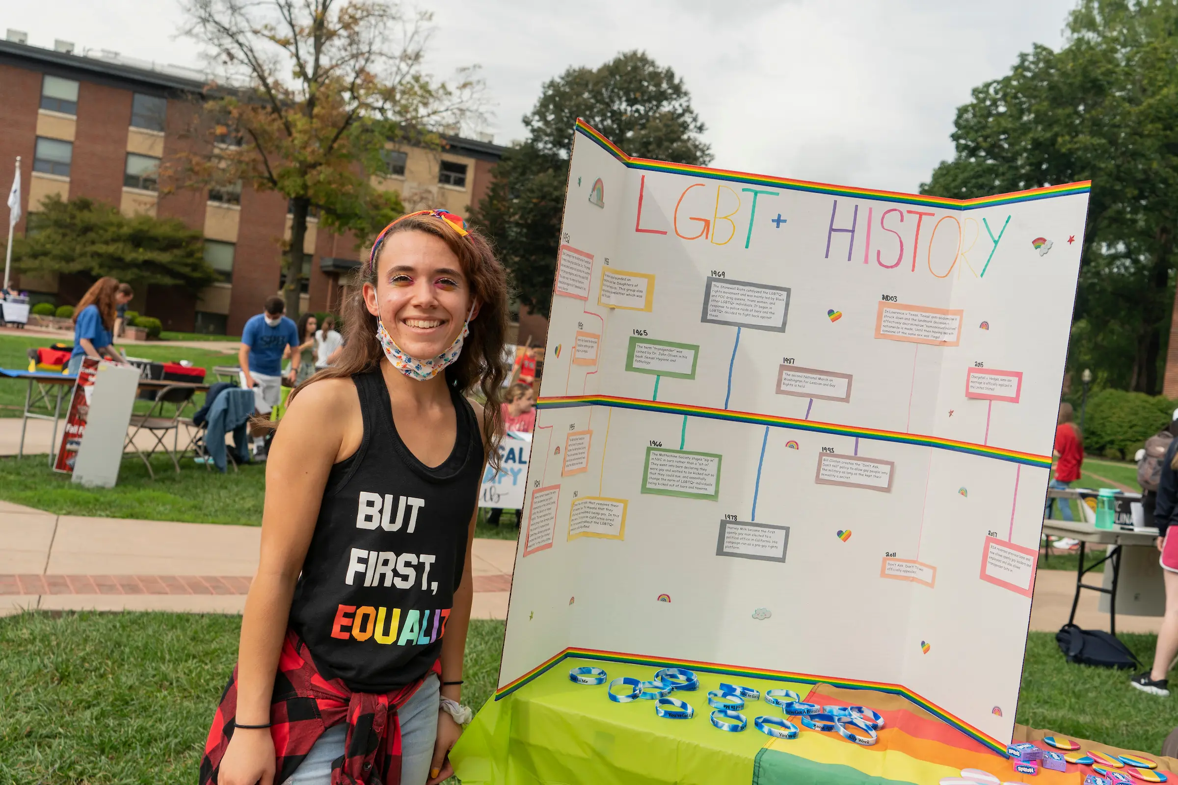 Student hosts LGBTQ table at student engagement fair.