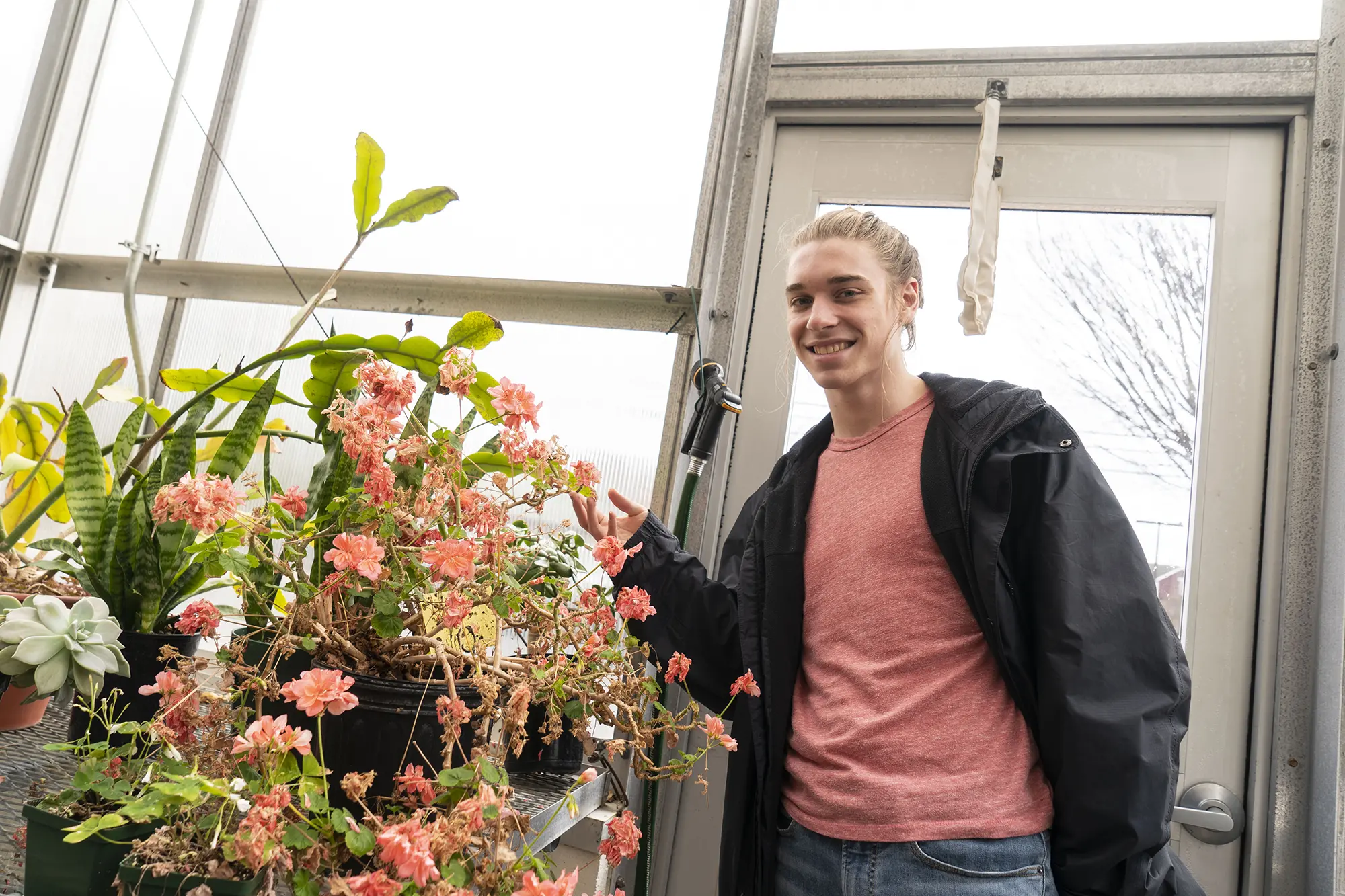Jake Beidler in the greenhouse
