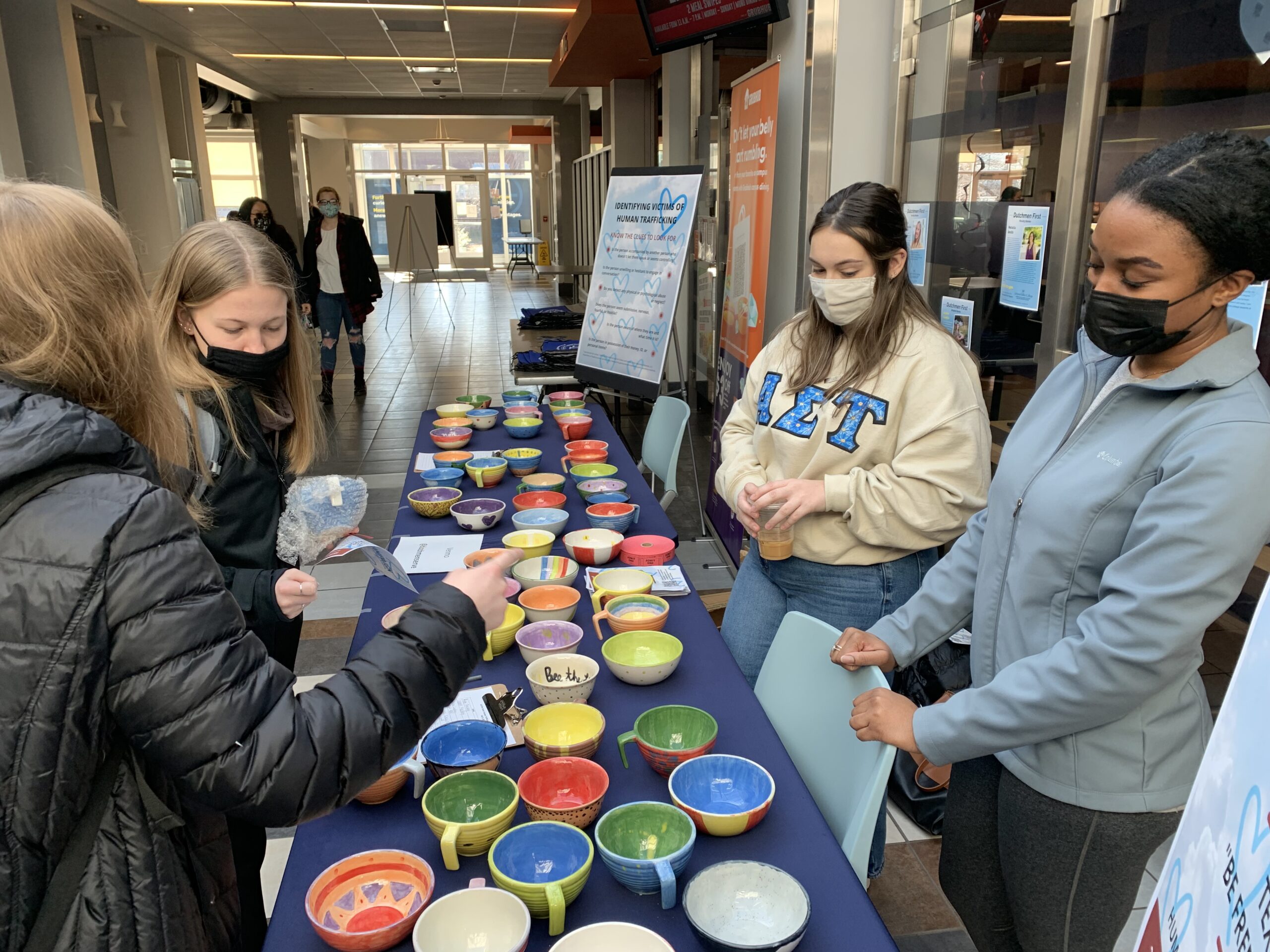 students sell hand-painted bowls for Souper Bowl event