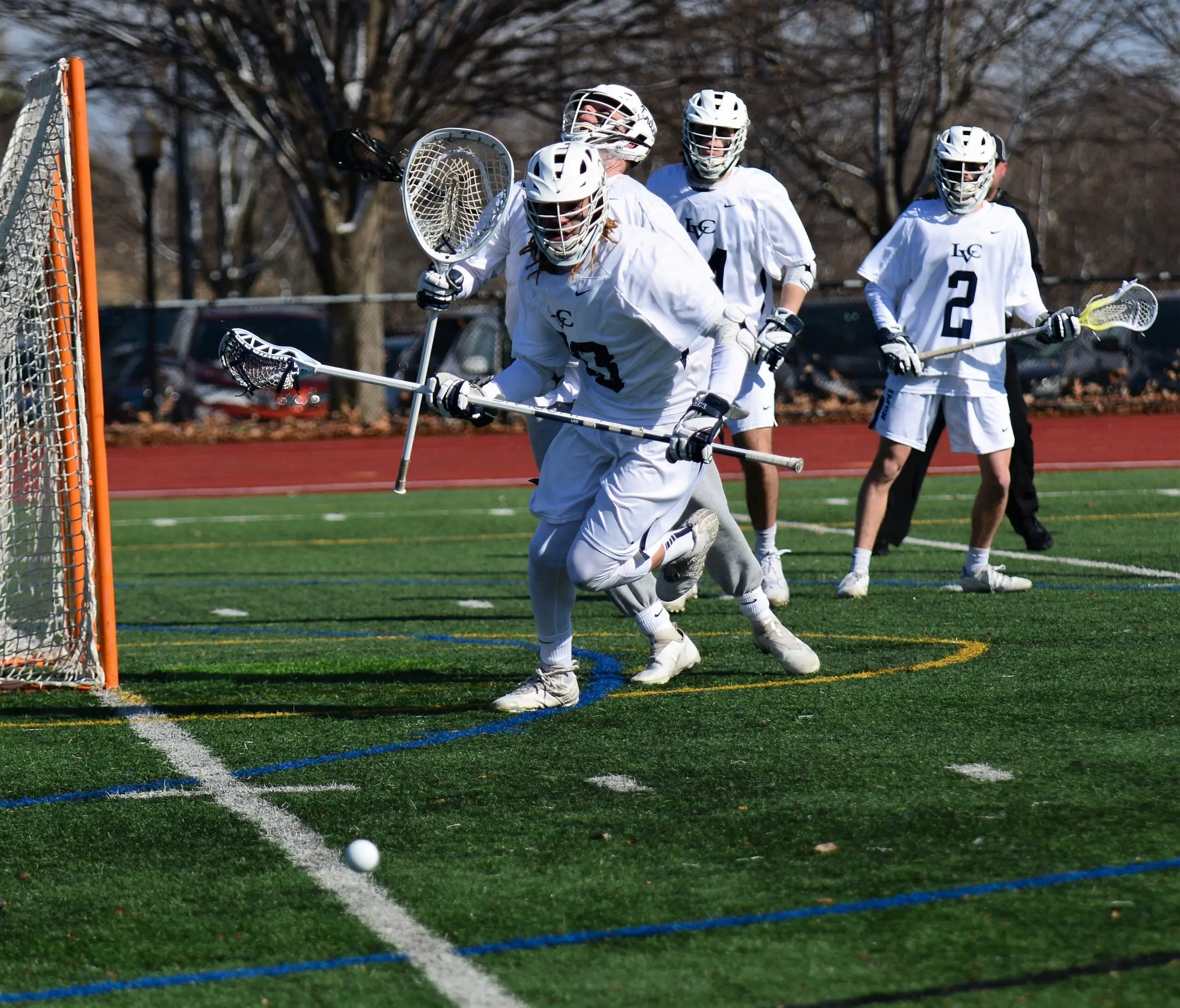 LVC men's lacrosse players on field