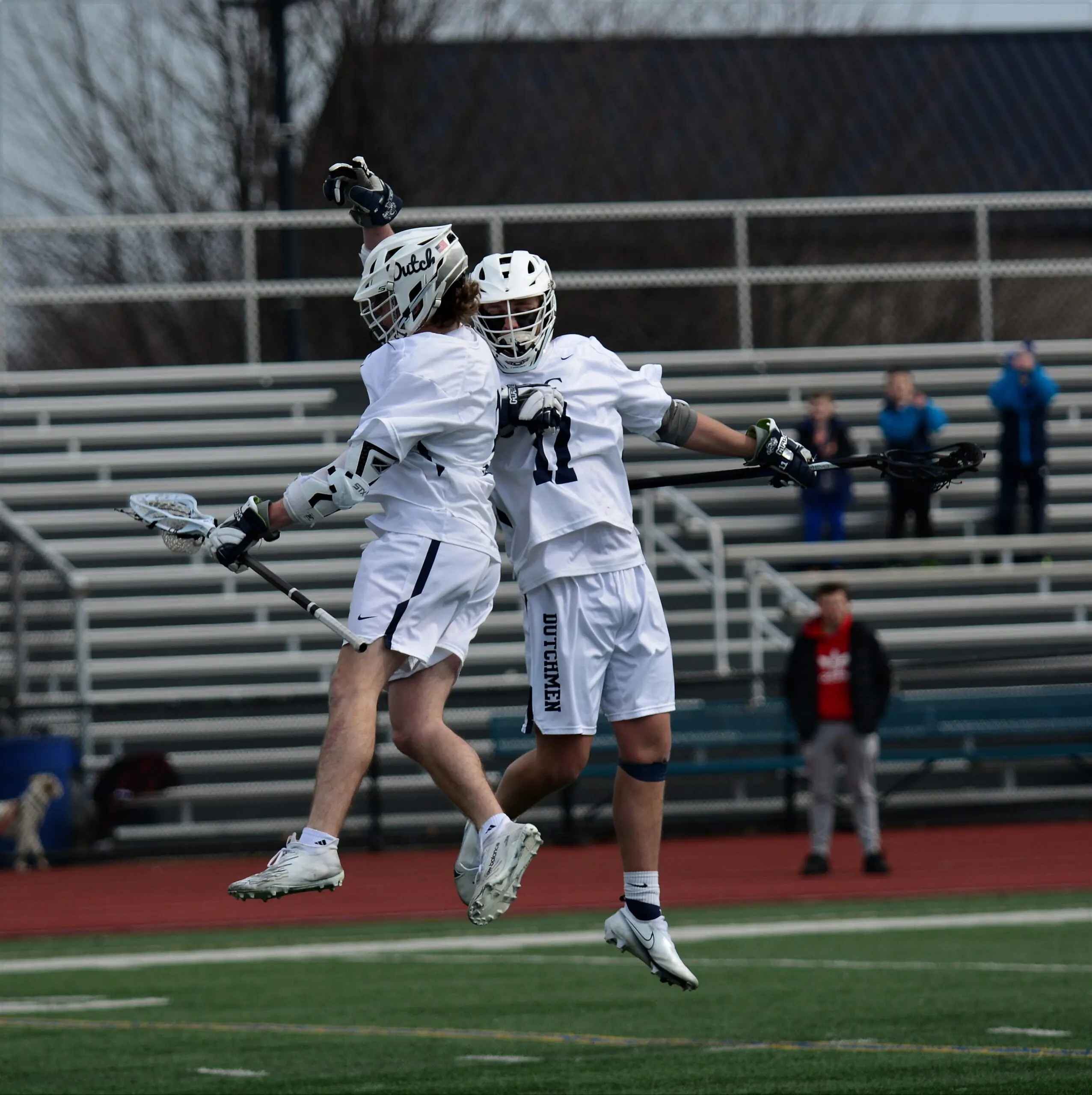 LVC men's lacrosse players on field