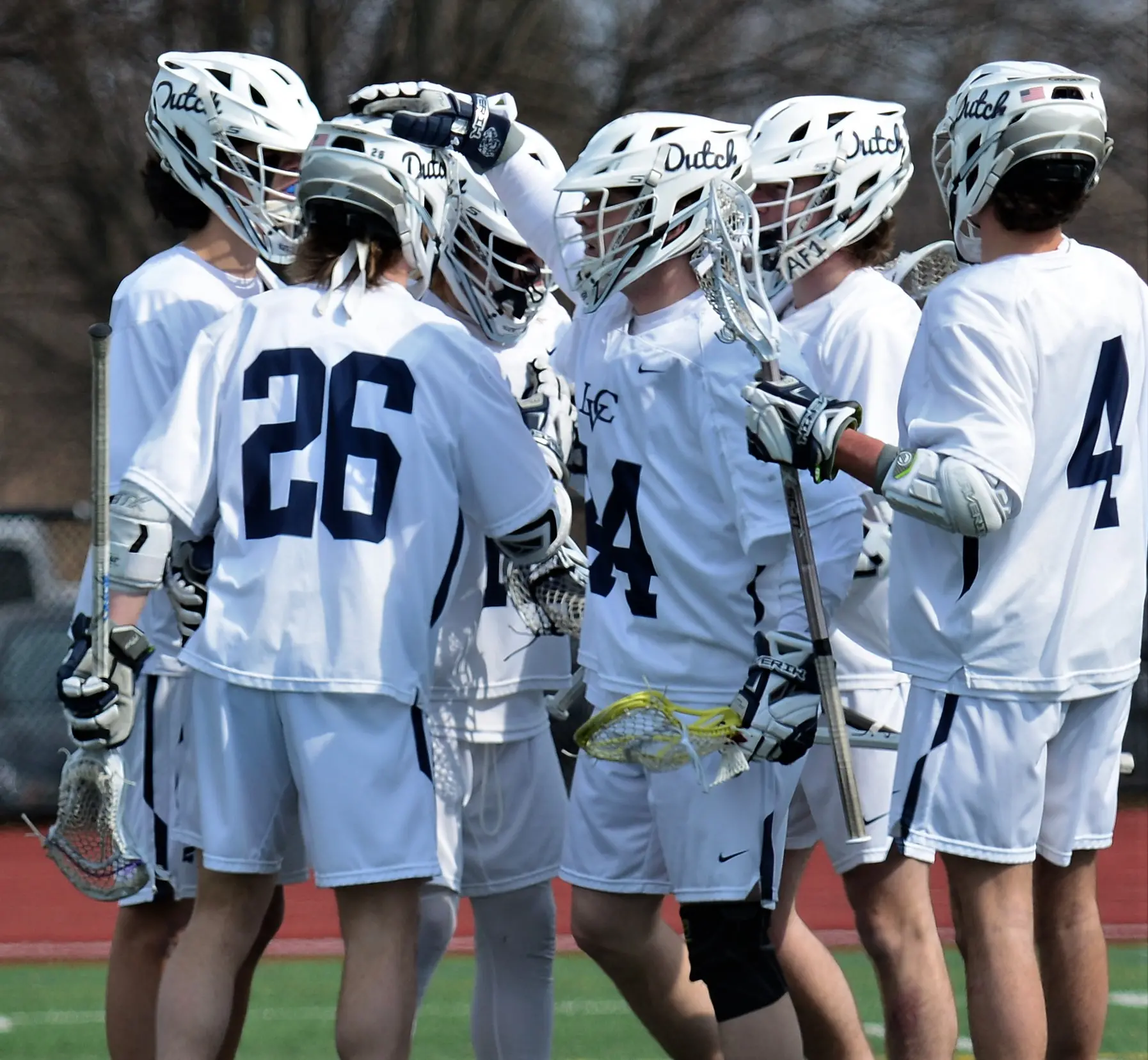 LVC men's lacrosse players on field