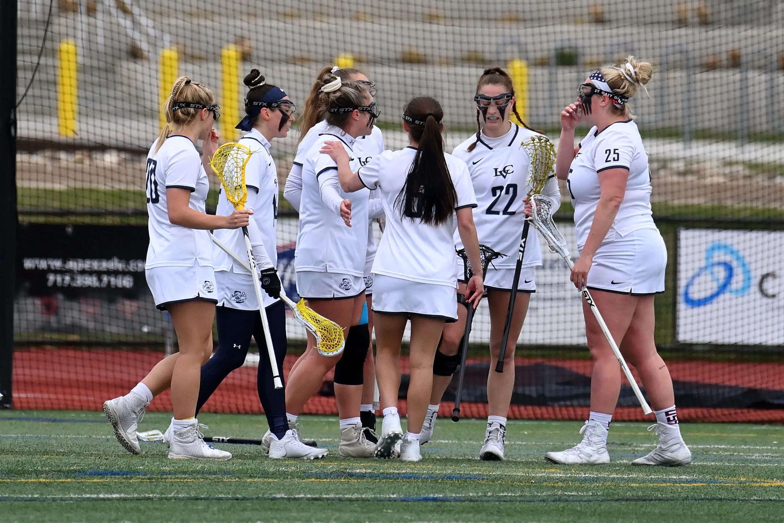 An LVC women's lacrosse players on the field.