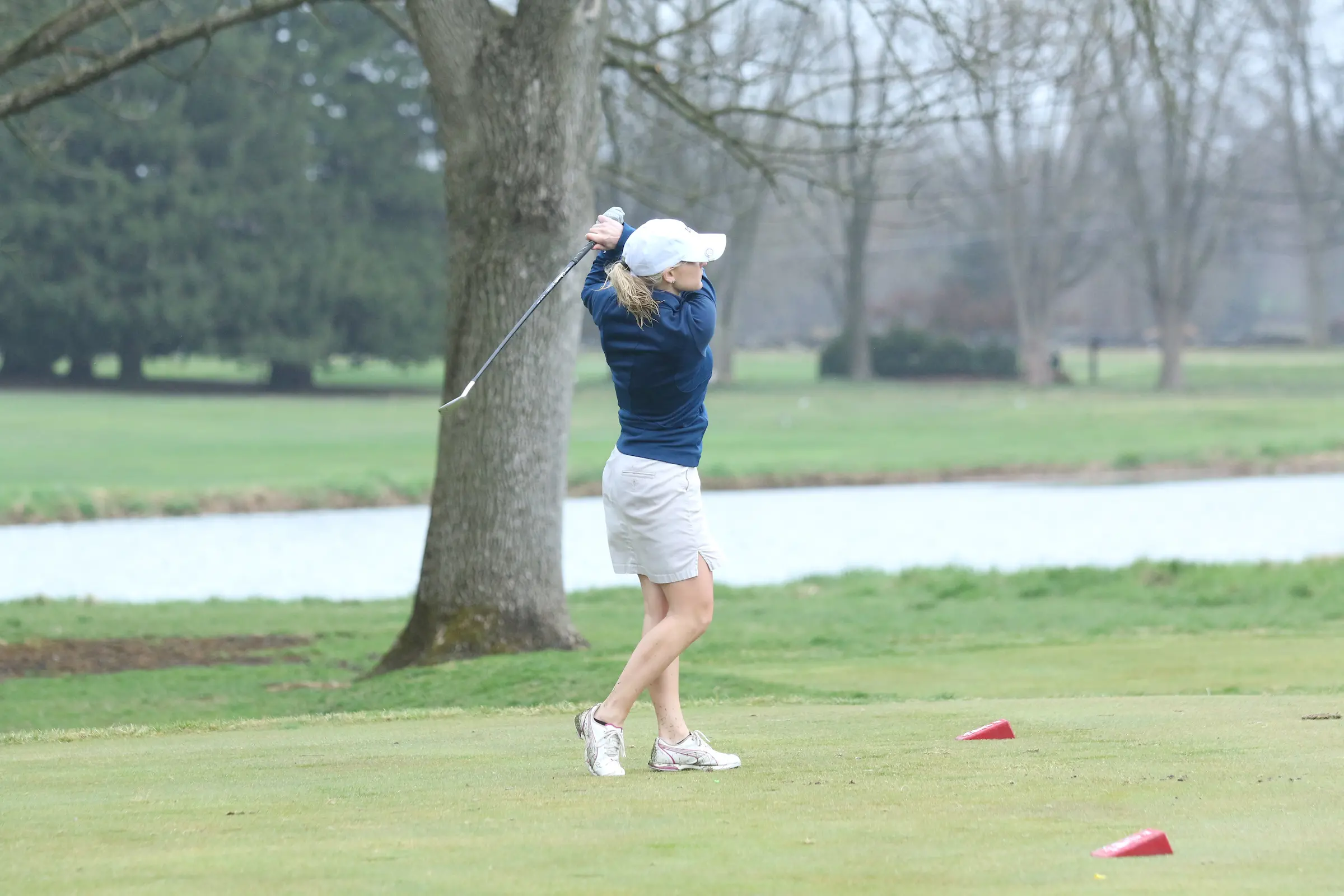 LVC women's golf team member swings club