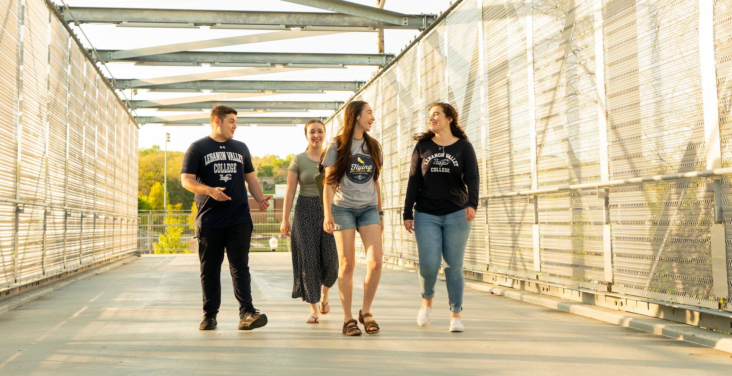 Students walk across bridge on LVC campus
