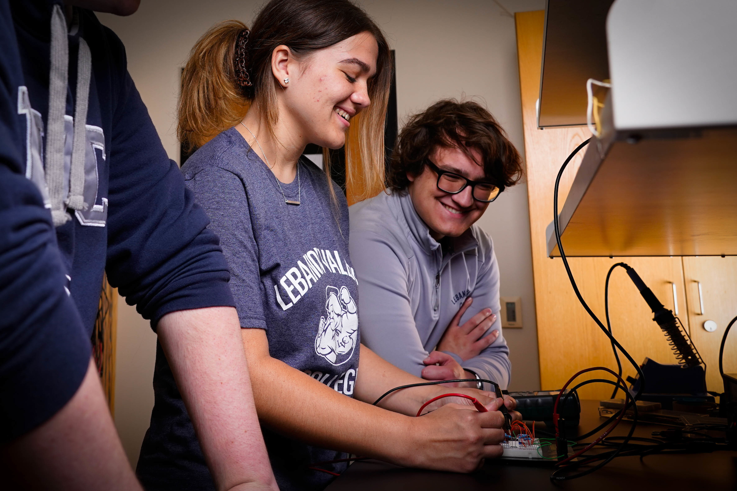 Research First physics students Faye Gibson (left), Michael Harris (right) in lab