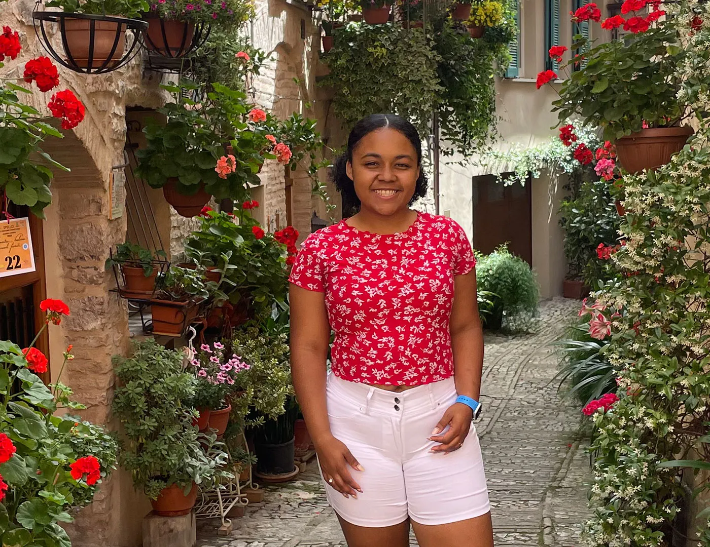 Ellie Flores on a street in Italy while studying abroad