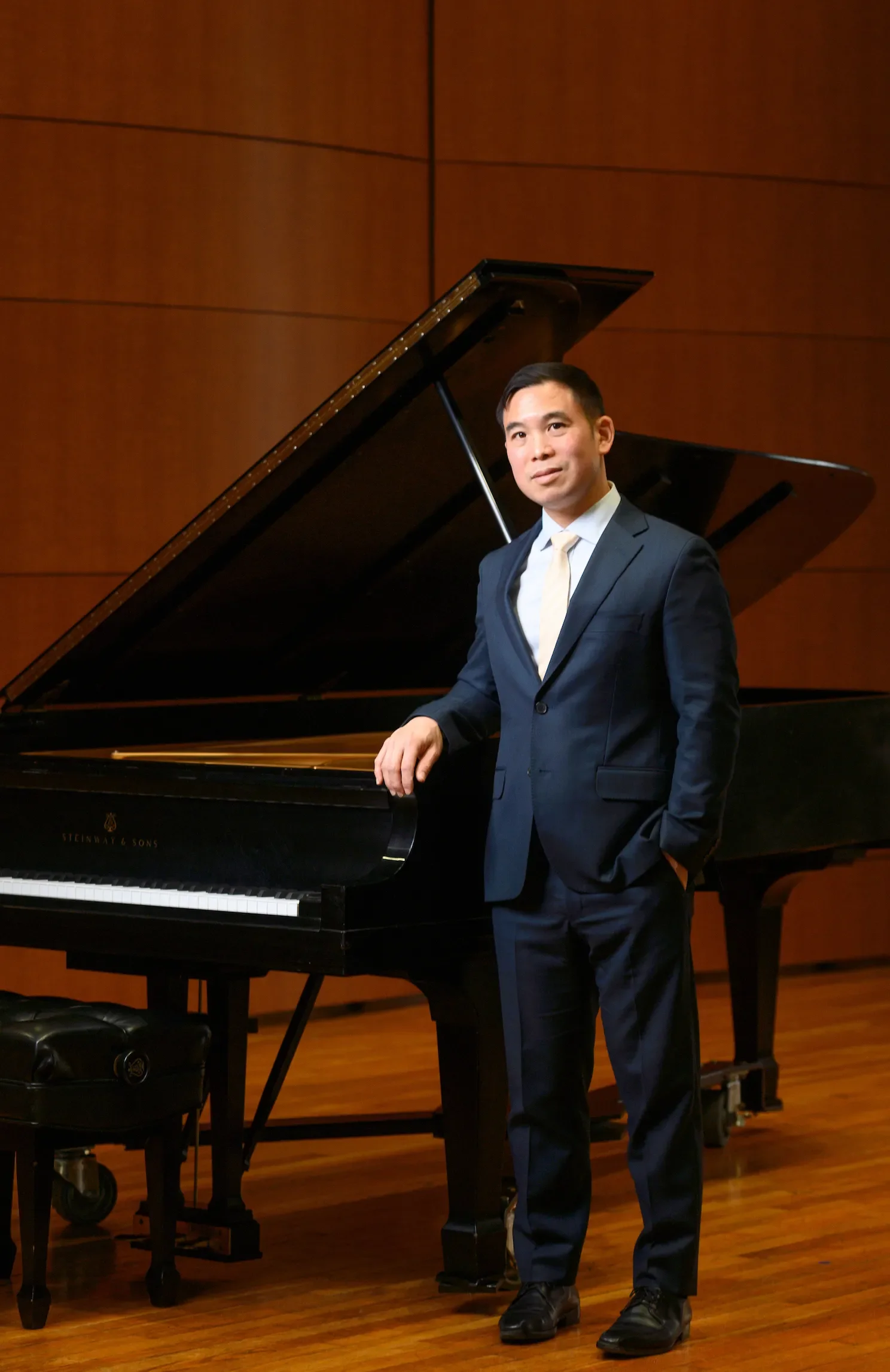Dr. Henry Wong Doe of the IUP Music Department performs on the piano during a video production for an IUP brand story in Gorrell Recital Hall on March 30, 2023.