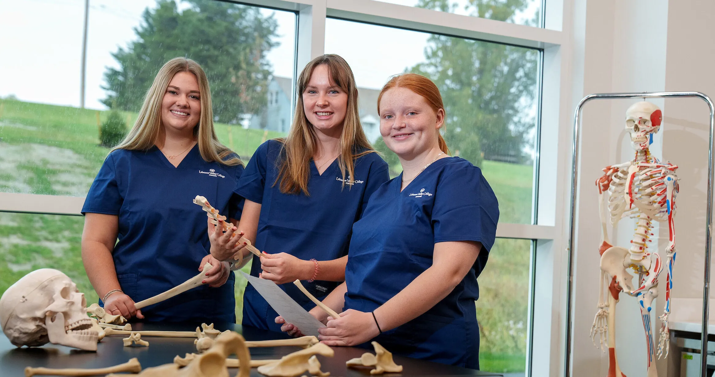 LVC nursing students examine bone models in nursing building