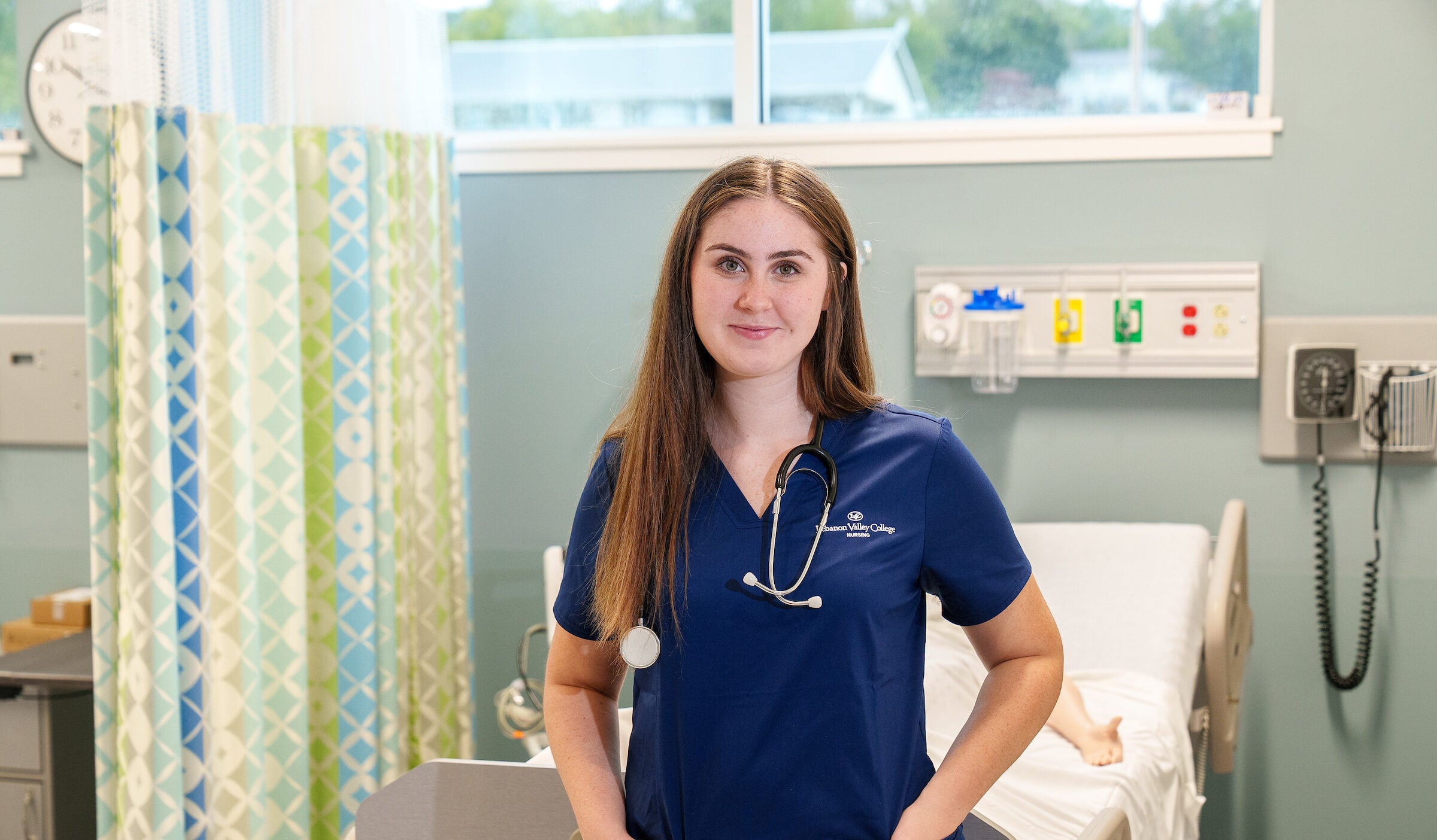 LVC nursing student wearing scrubs in simulation lab