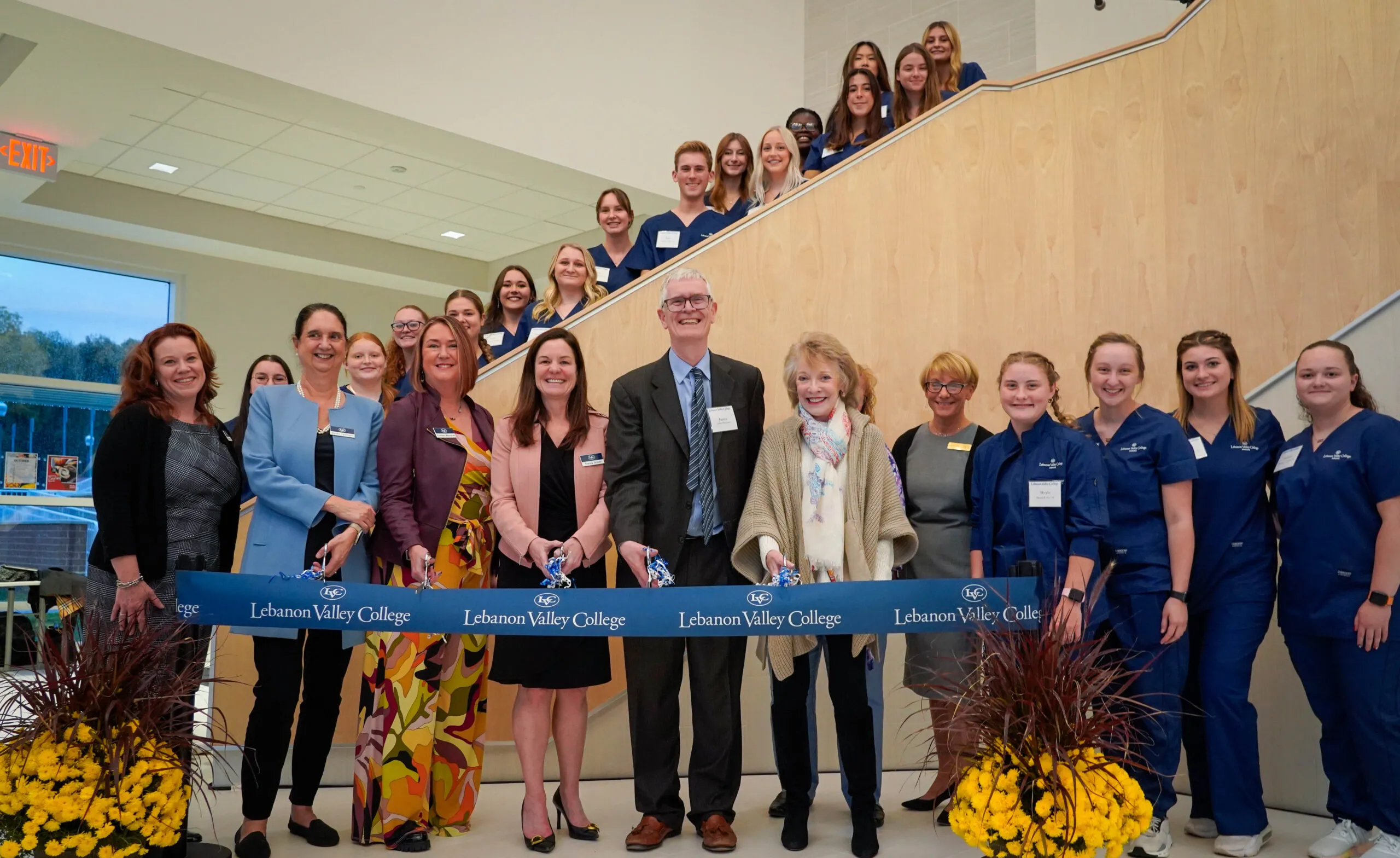 LVC President James MacLaren and staff cut ribbon in honor of new nursing facility.