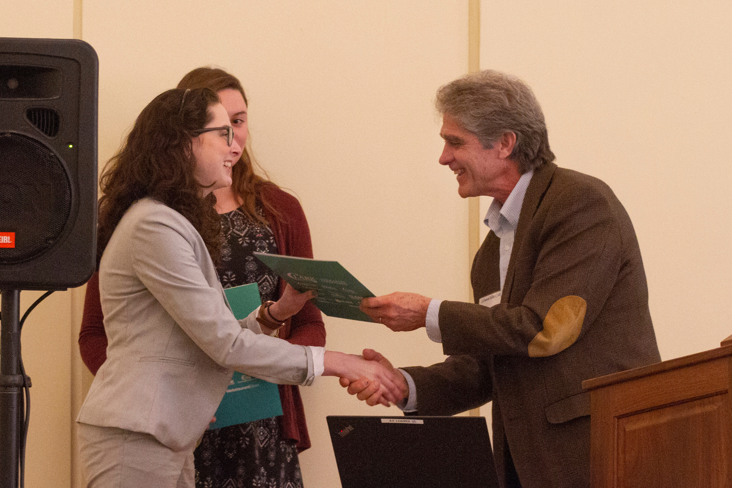 Gabrielle Cressman (gray jacket) and Nicole Flohr receive scholarships from Clark Associates