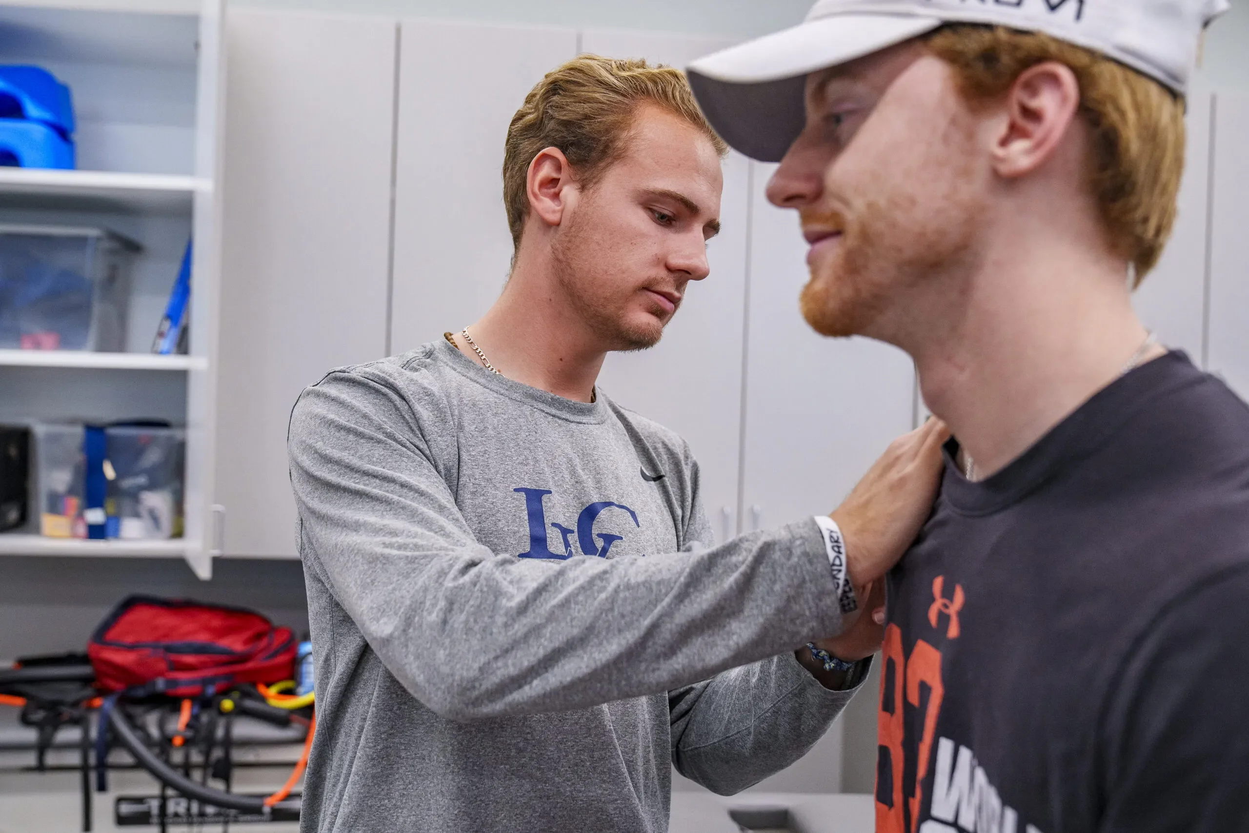 Students practice techniques during physical therapy class.