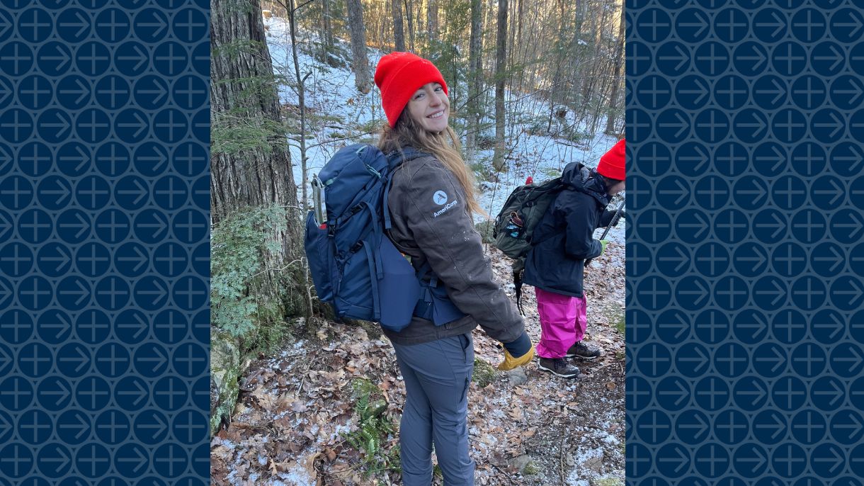 Environmental science alumna Shannon Peachey walks in the woods
