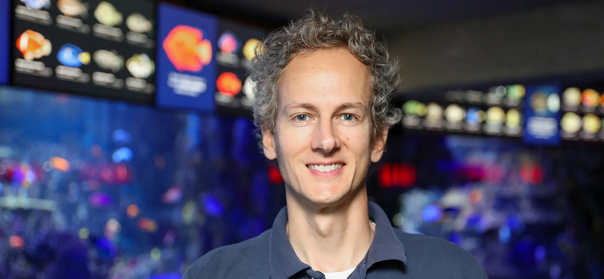 Biology graduate Jeremy Brodt as the manager of galleries at the New England Aquarium