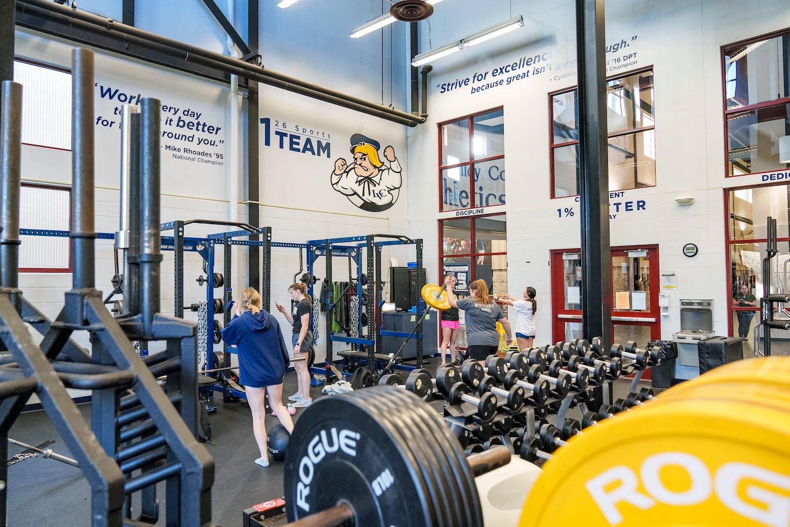 Students work out in weight room in Arnold Sports Center