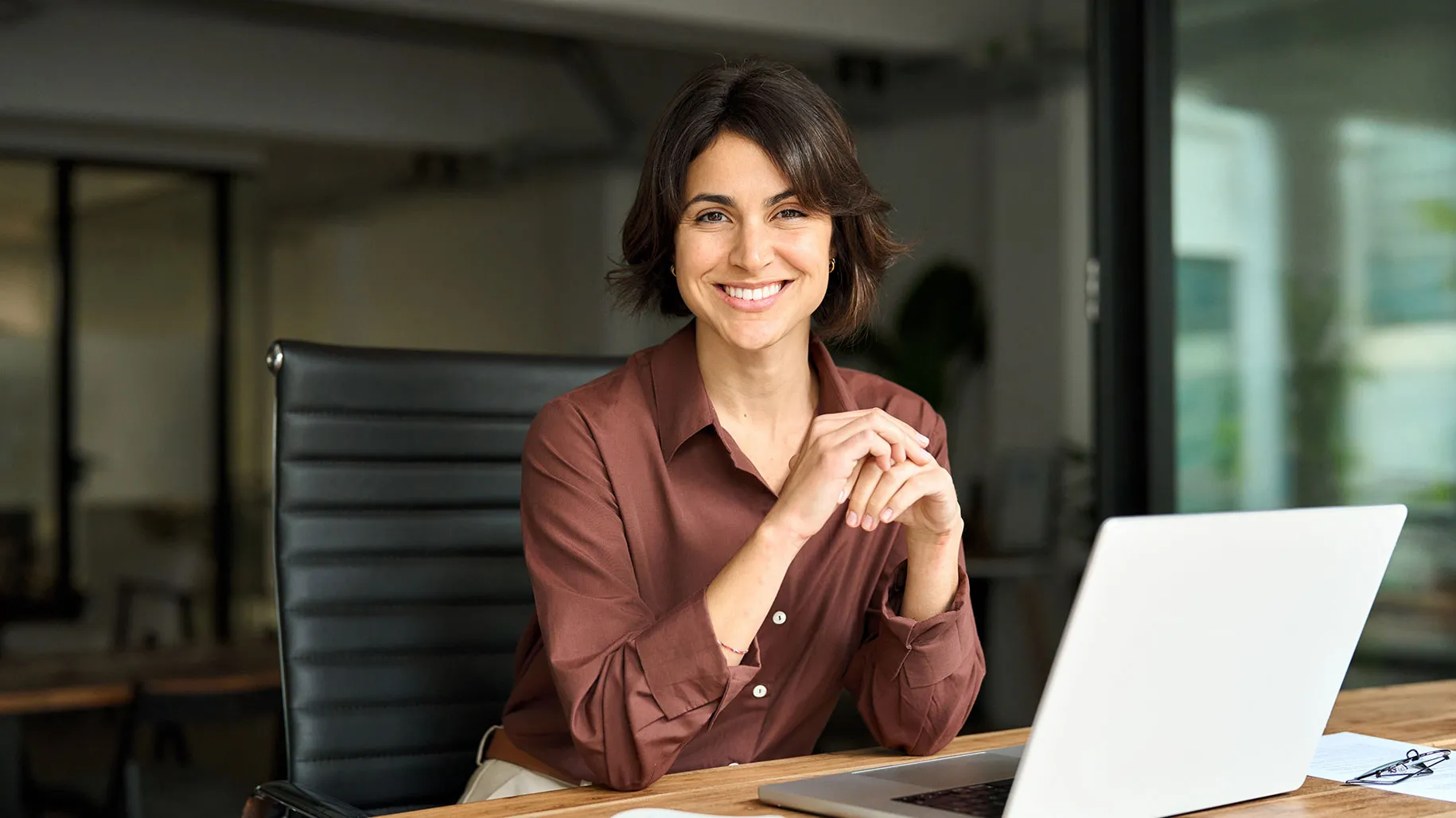 Woman sitting with laptop