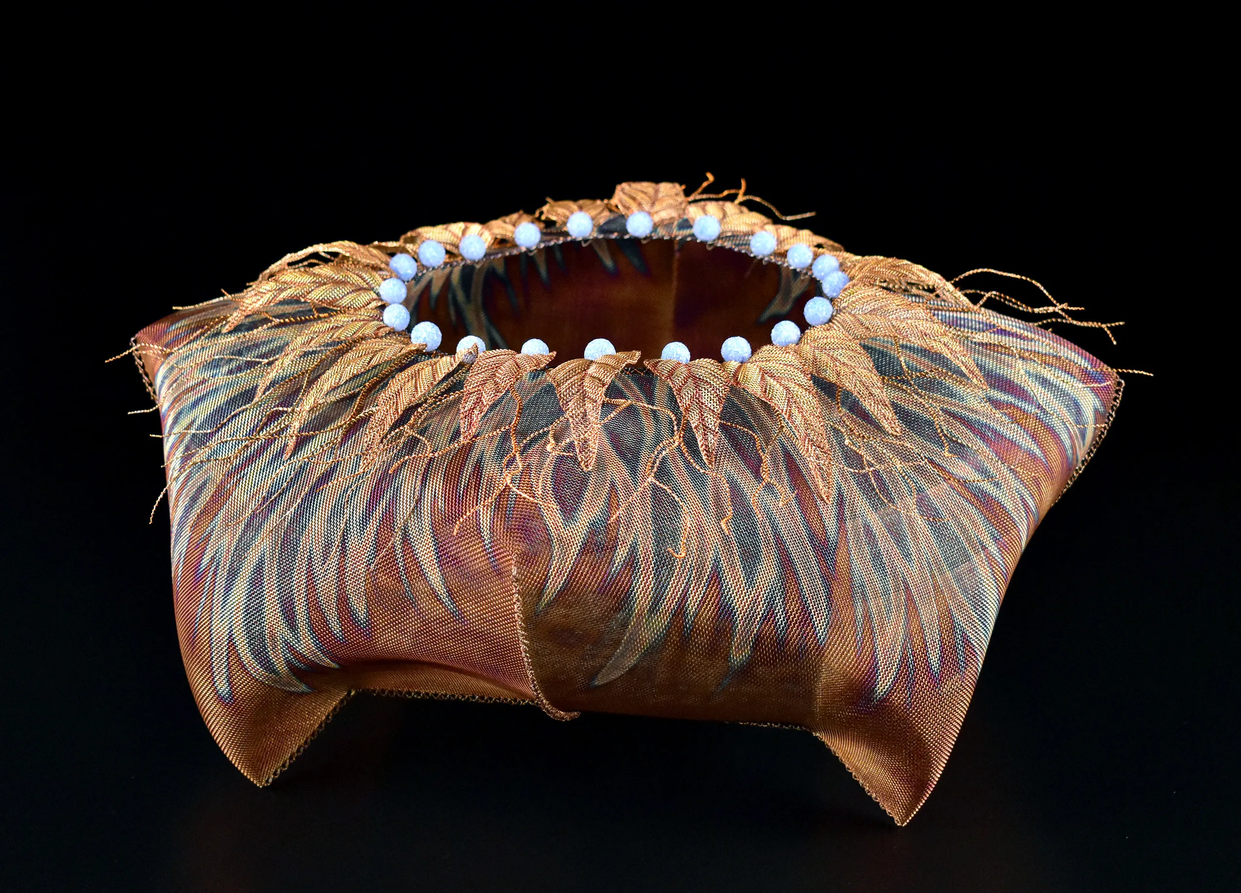 Lanny Bergner, Blueterra Basket, 2021, flame-painted stainless-steel, copper mesh, and mixed media, 9 x 20 x 20 inches, courtesy of the artist