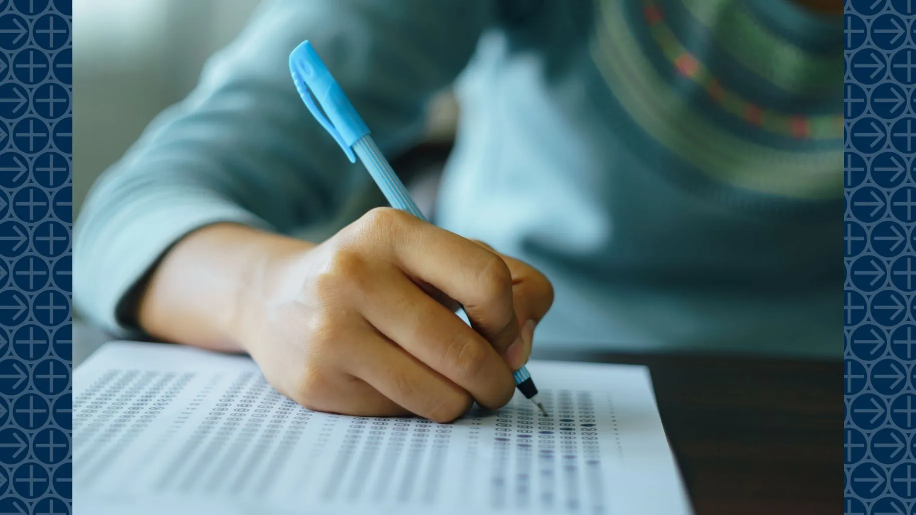 Student fills answer bubbles on exam sheet