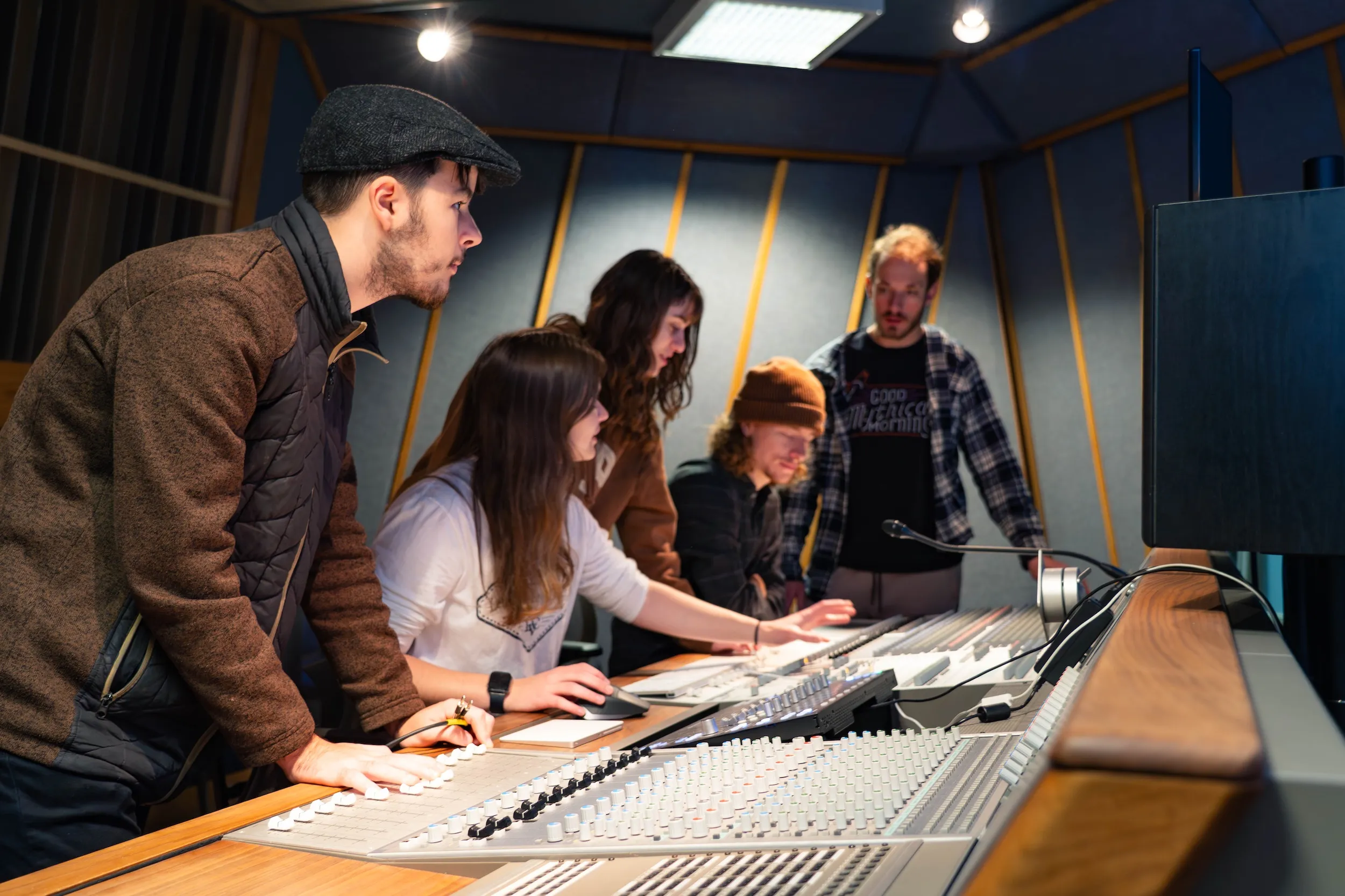Students work in music production studio