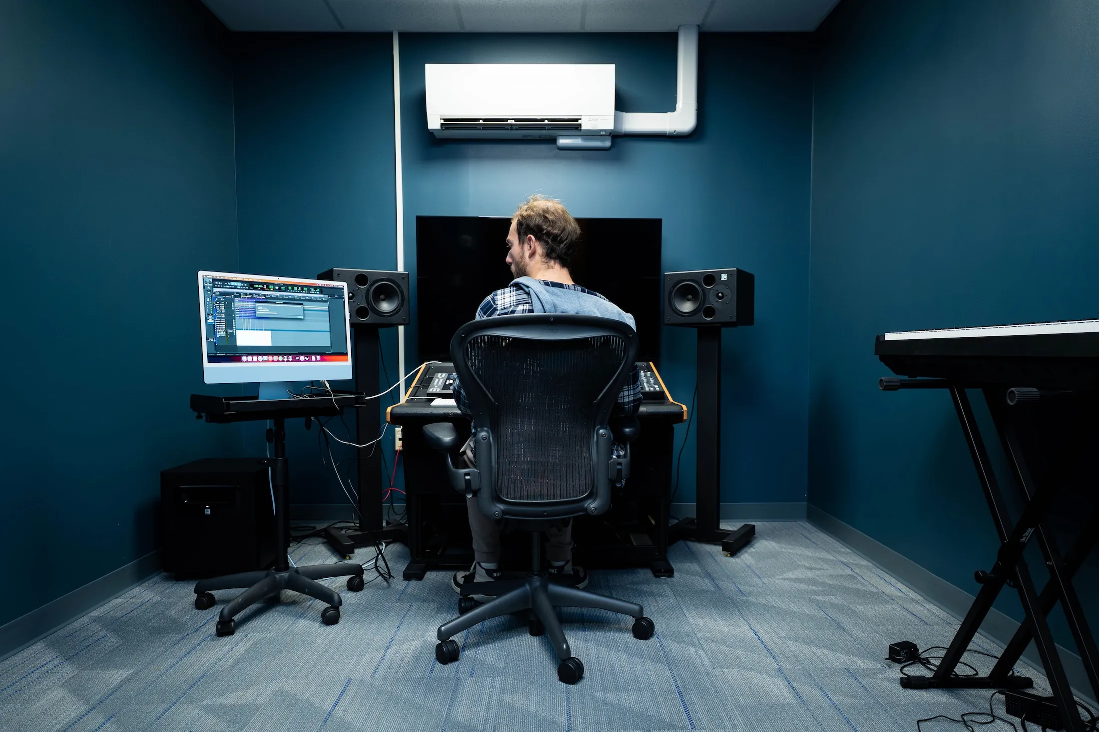 Student works in music production studio