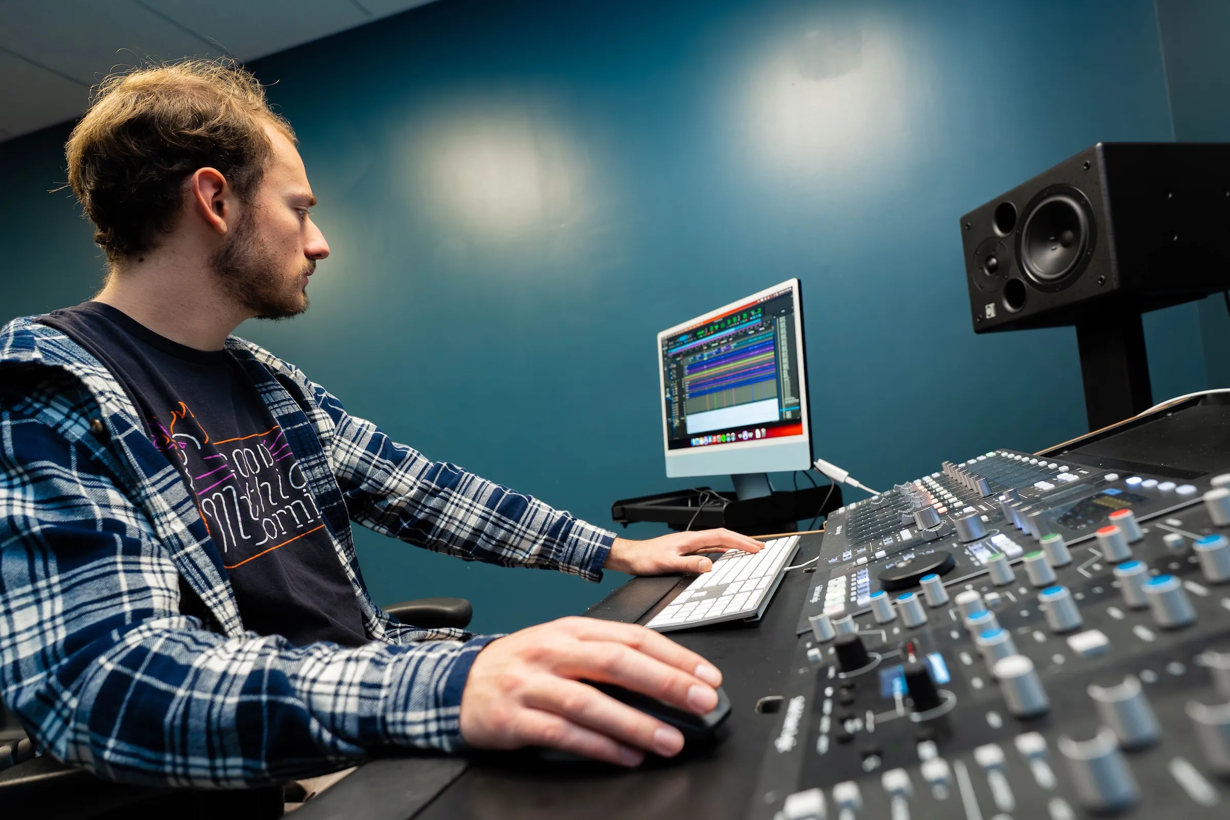 Student works in music production studio