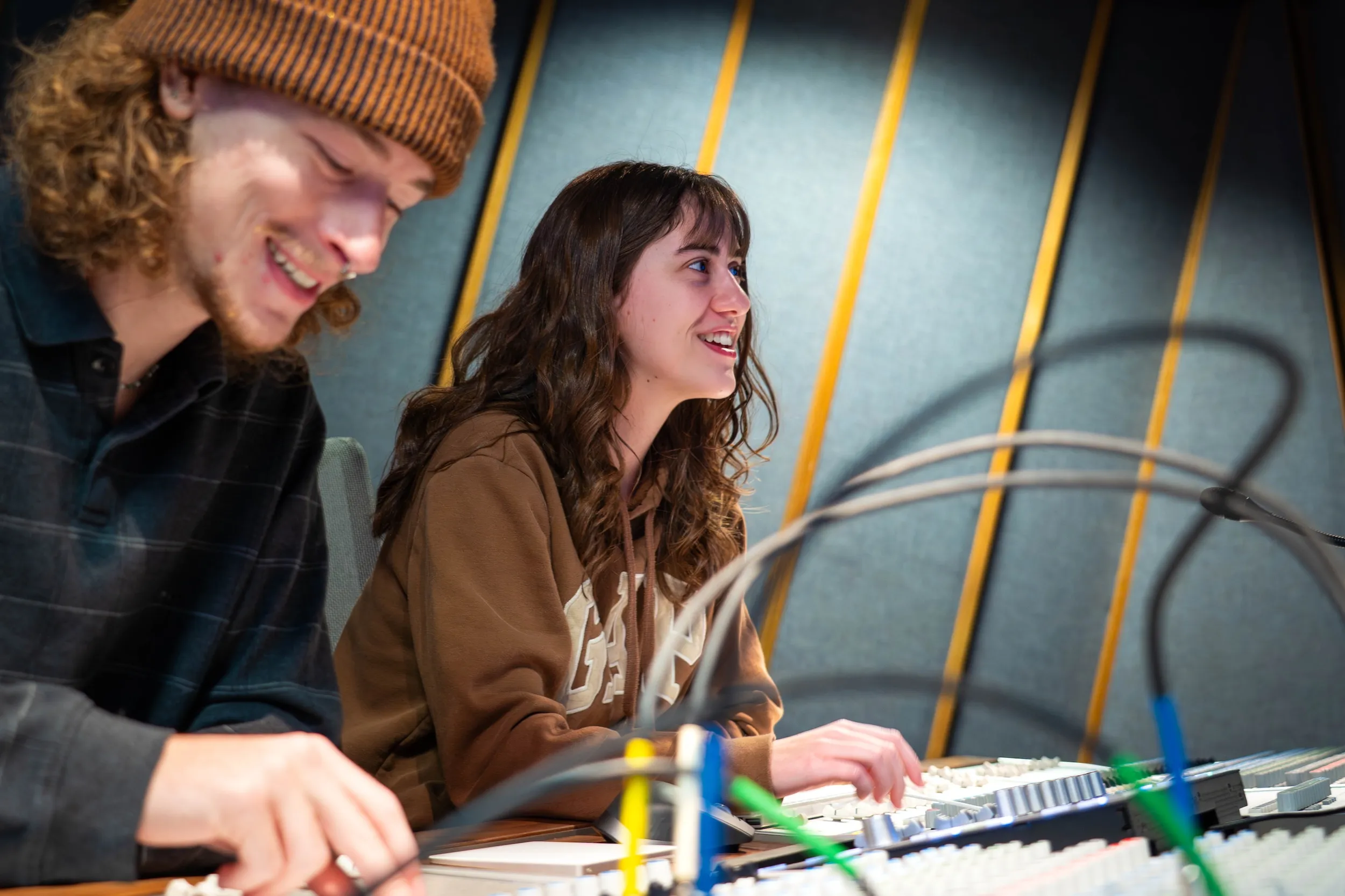Students work in music production studio