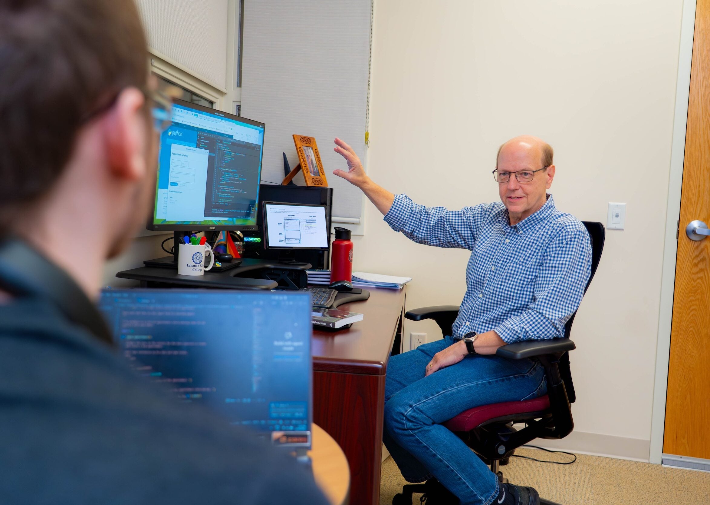 LVC computer science professor meets with student