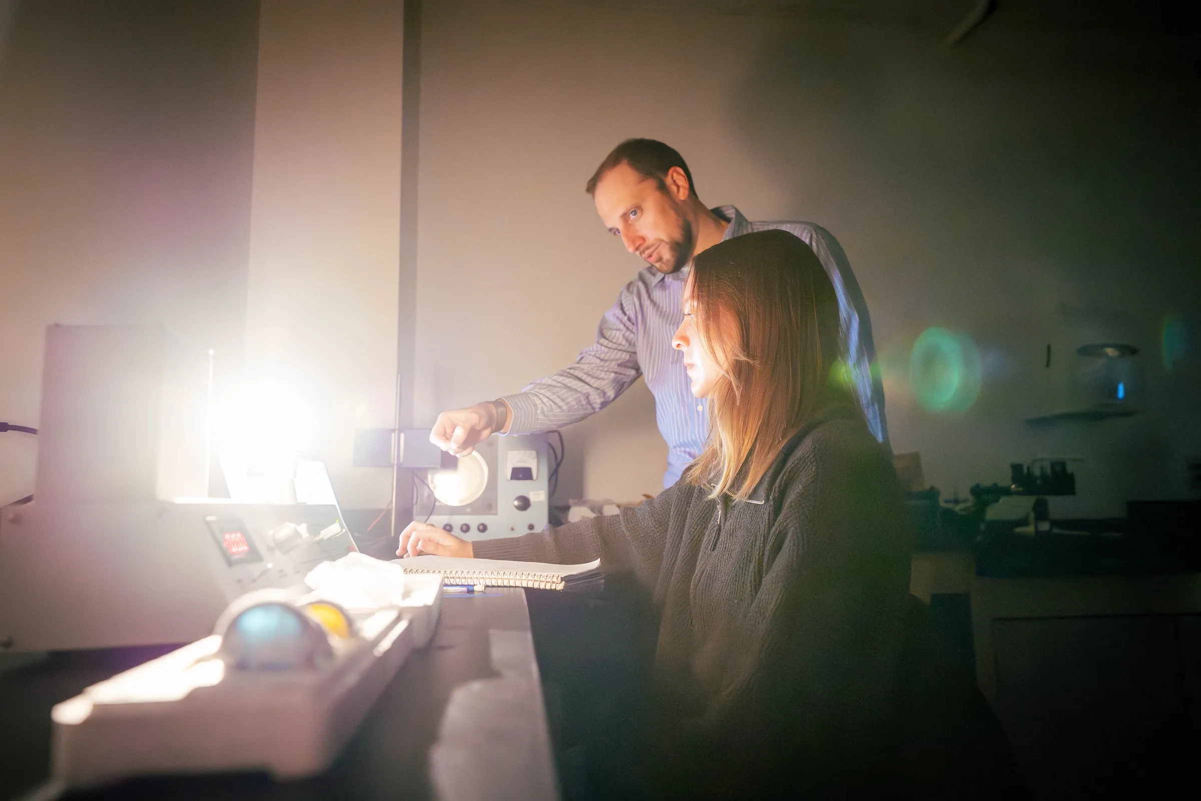 Student and professor in physics lab