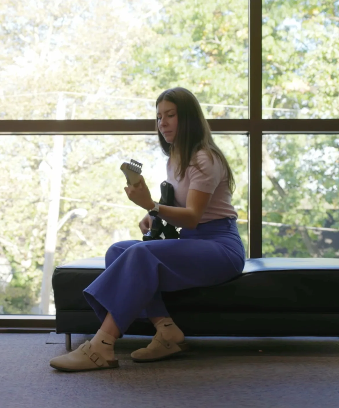 Master of Music Education student Sarah Benson plays guitar