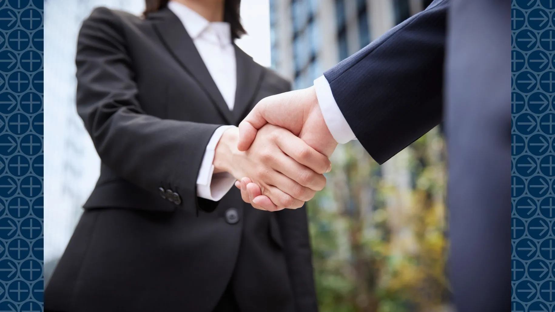 Two business professionals shake hands