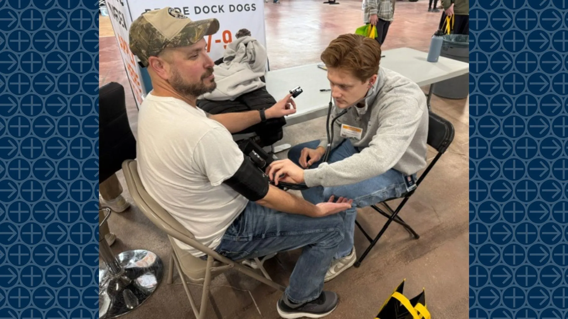 As part of an ongoing hunter health study, fifth-year Lebanon Valley College physical therapy student Evan Kutzler checks the resting heart rate and blood pressure of Lebanon County hunter Greg Lee during the NRA Great American Outdoor Show. (Photo by Tyler Frantz)