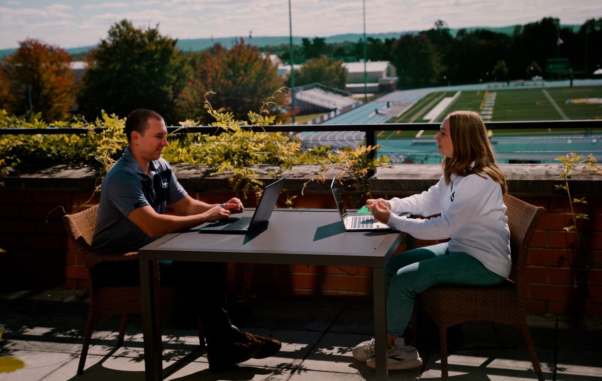 LVC student meets with professor on patio at Arnold Health Professions Pavilion (AHPP)