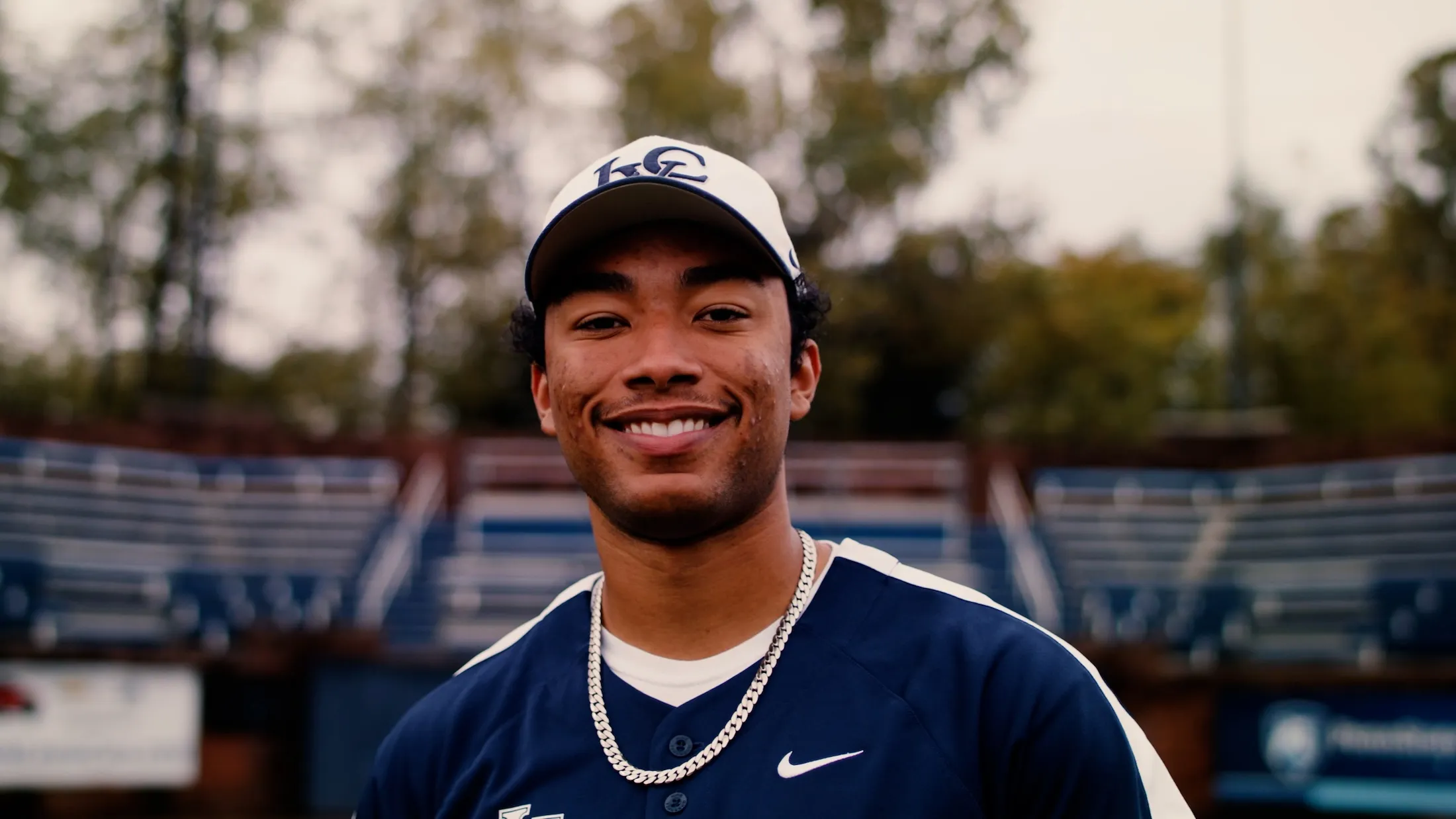 LVC baseball player smiles on field