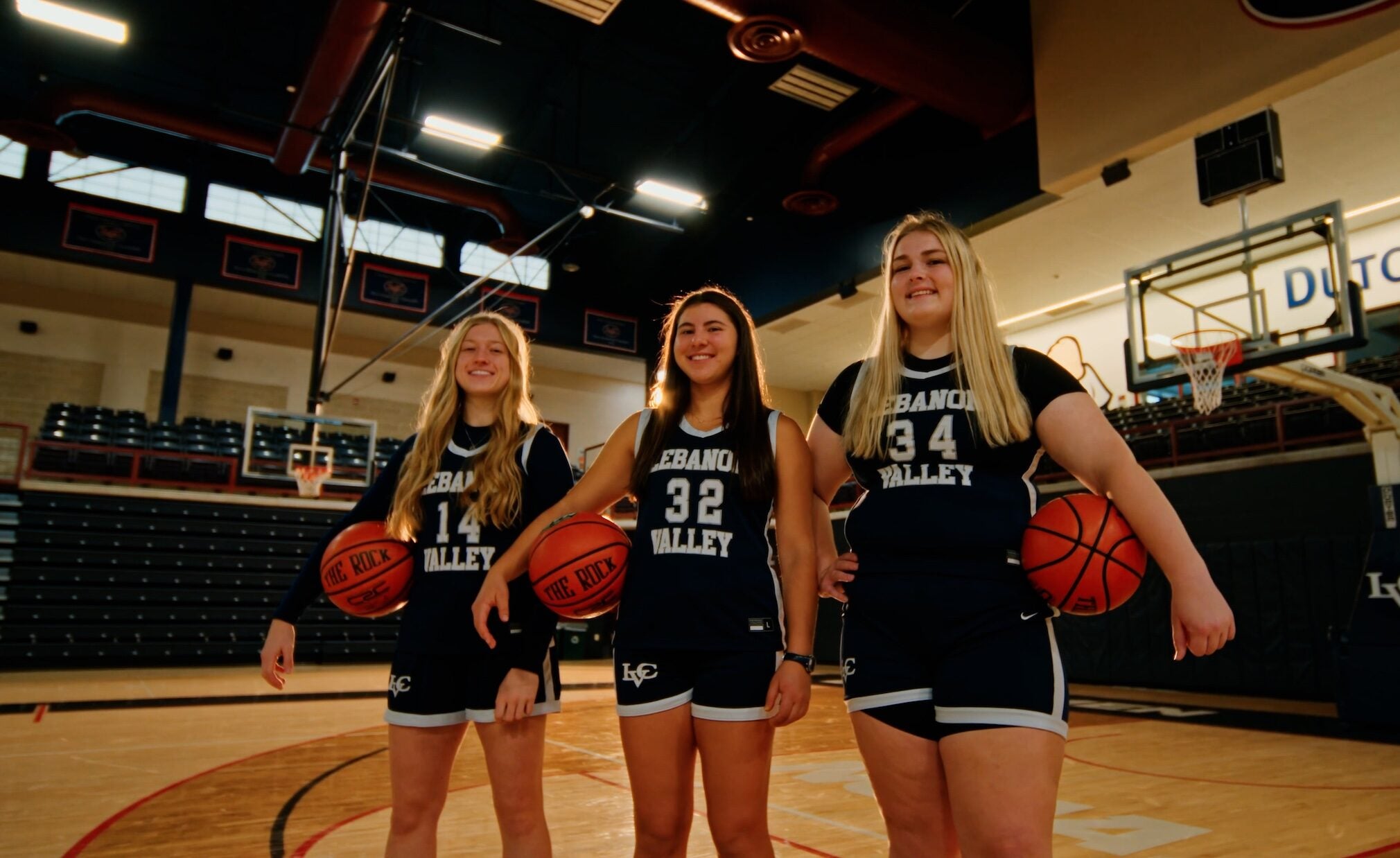 LVC women's basketball players pose on court