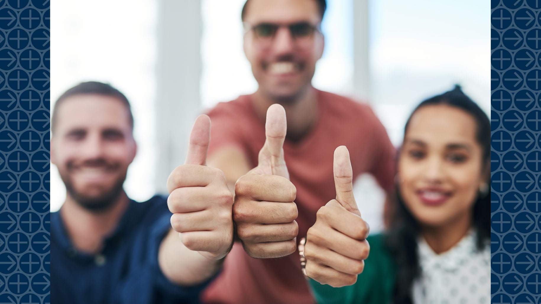 Three people hold out thumbs up