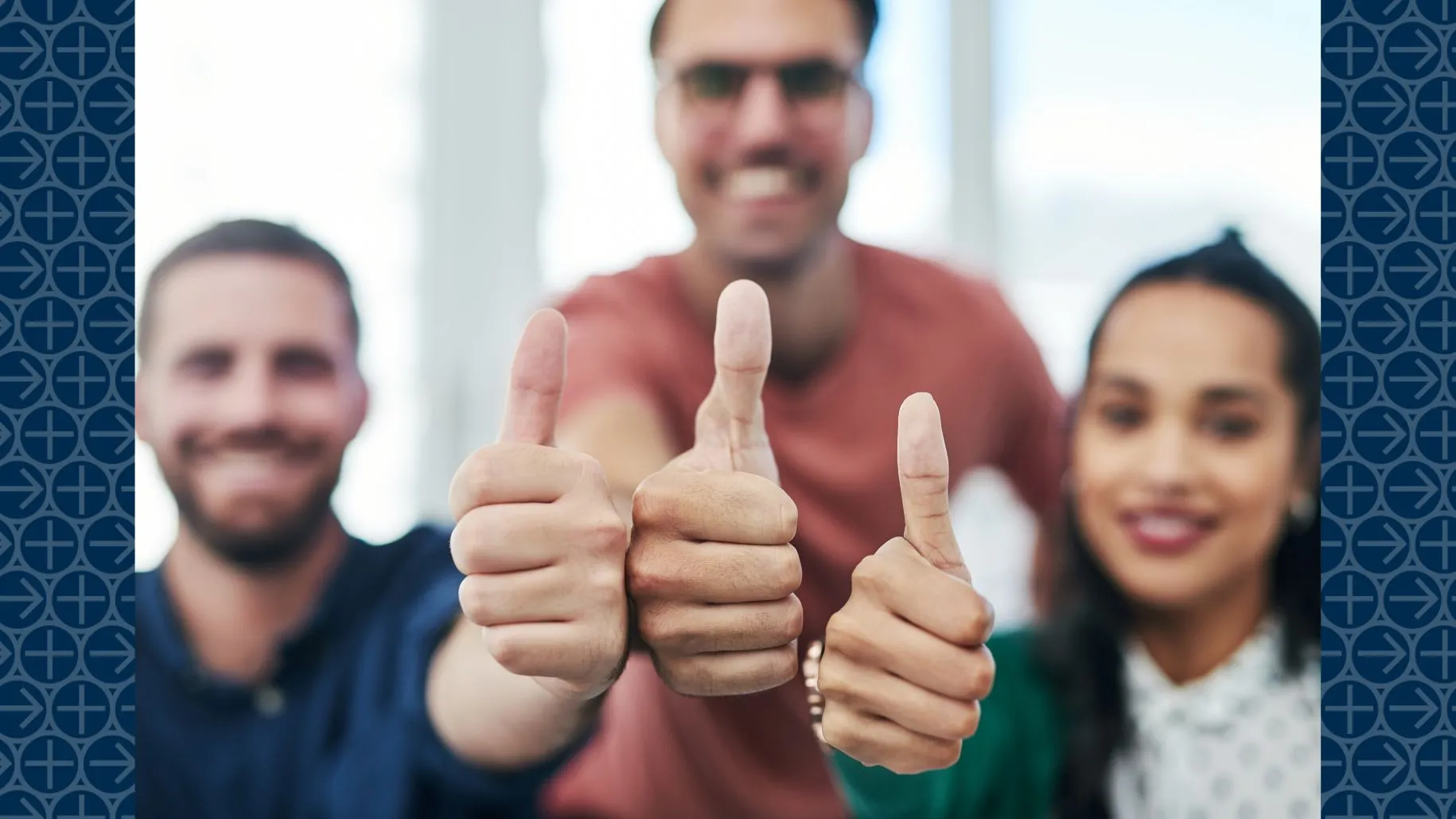 Three people hold out thumbs up