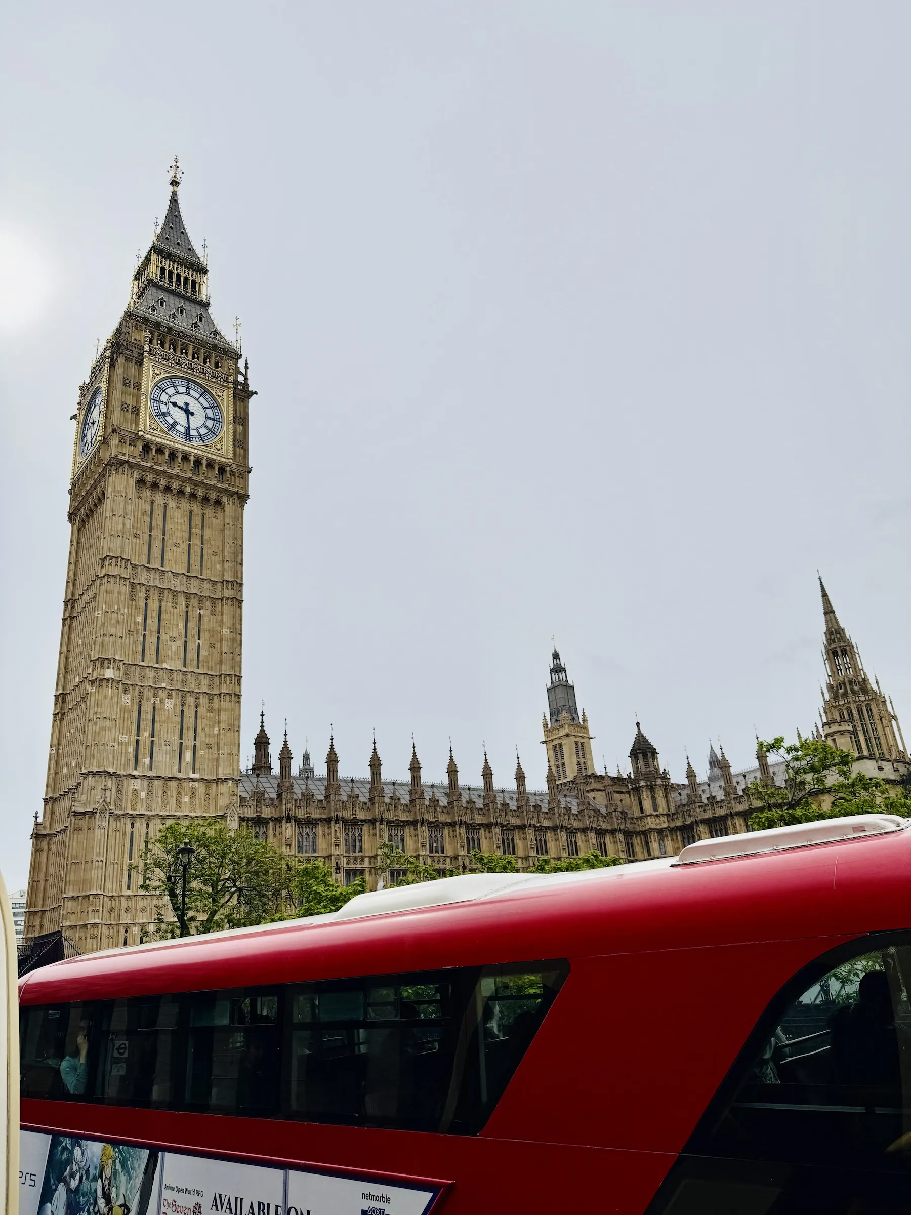 Bus drives past Big Ben in London