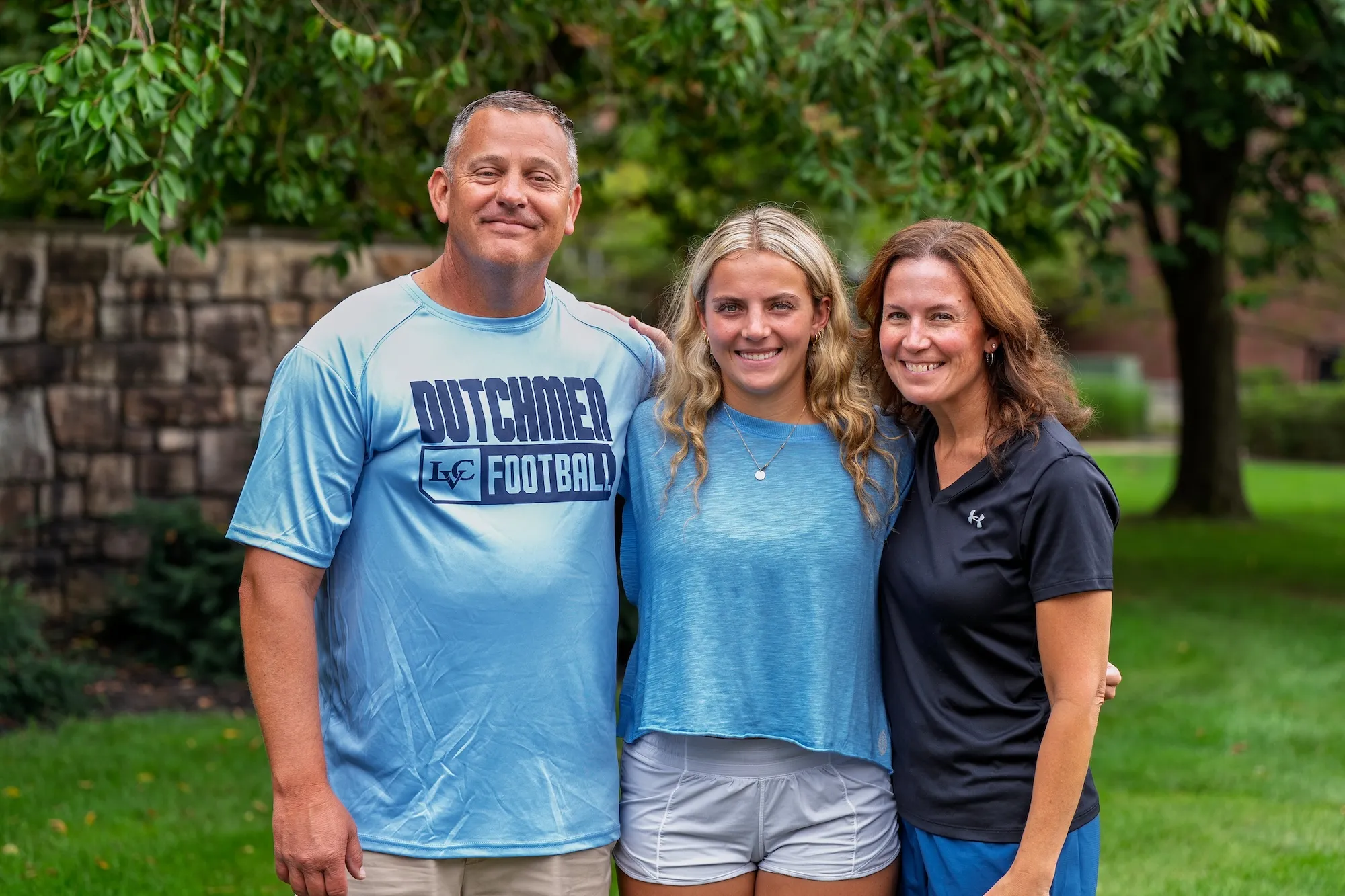 LVC legacy student poses with parents on move-in day 2026