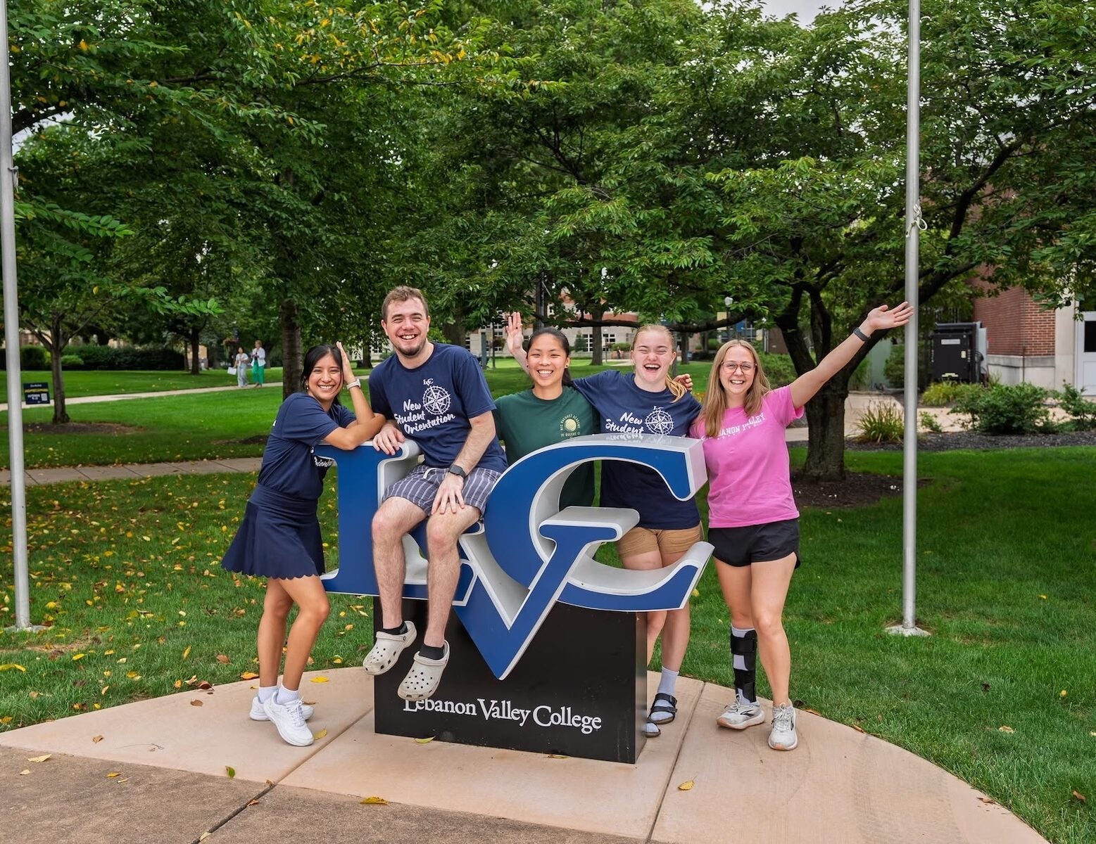 LVC students pose around LVC sign on move-in day