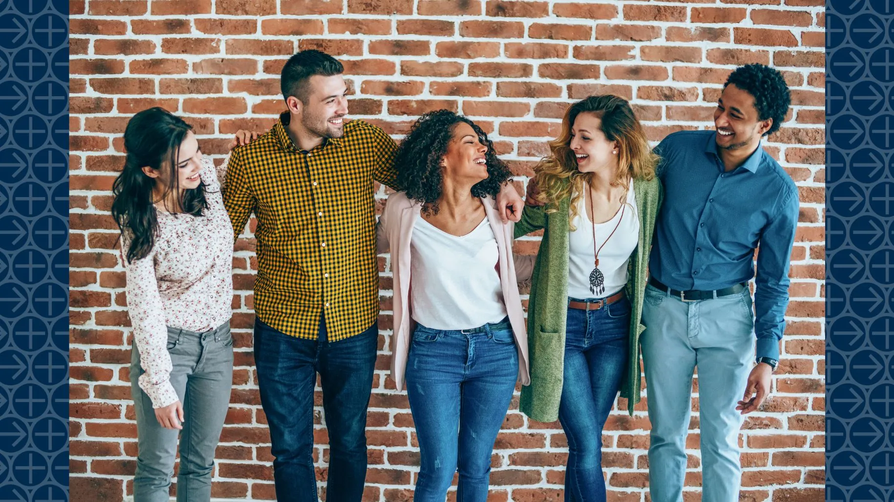 Group of young adults smile at each other