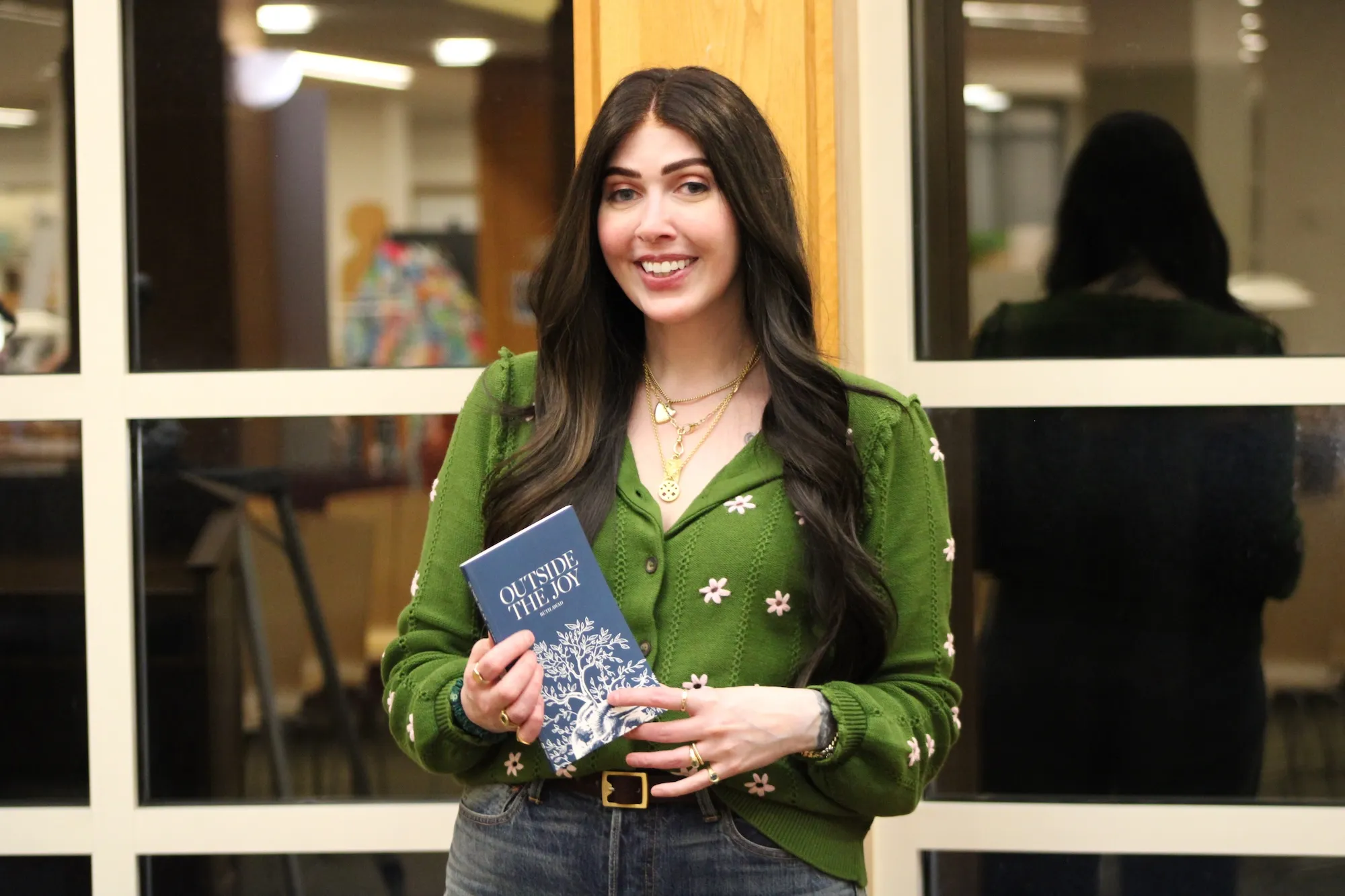 Ruth Awad with poetry collection, "Outside the Joy"