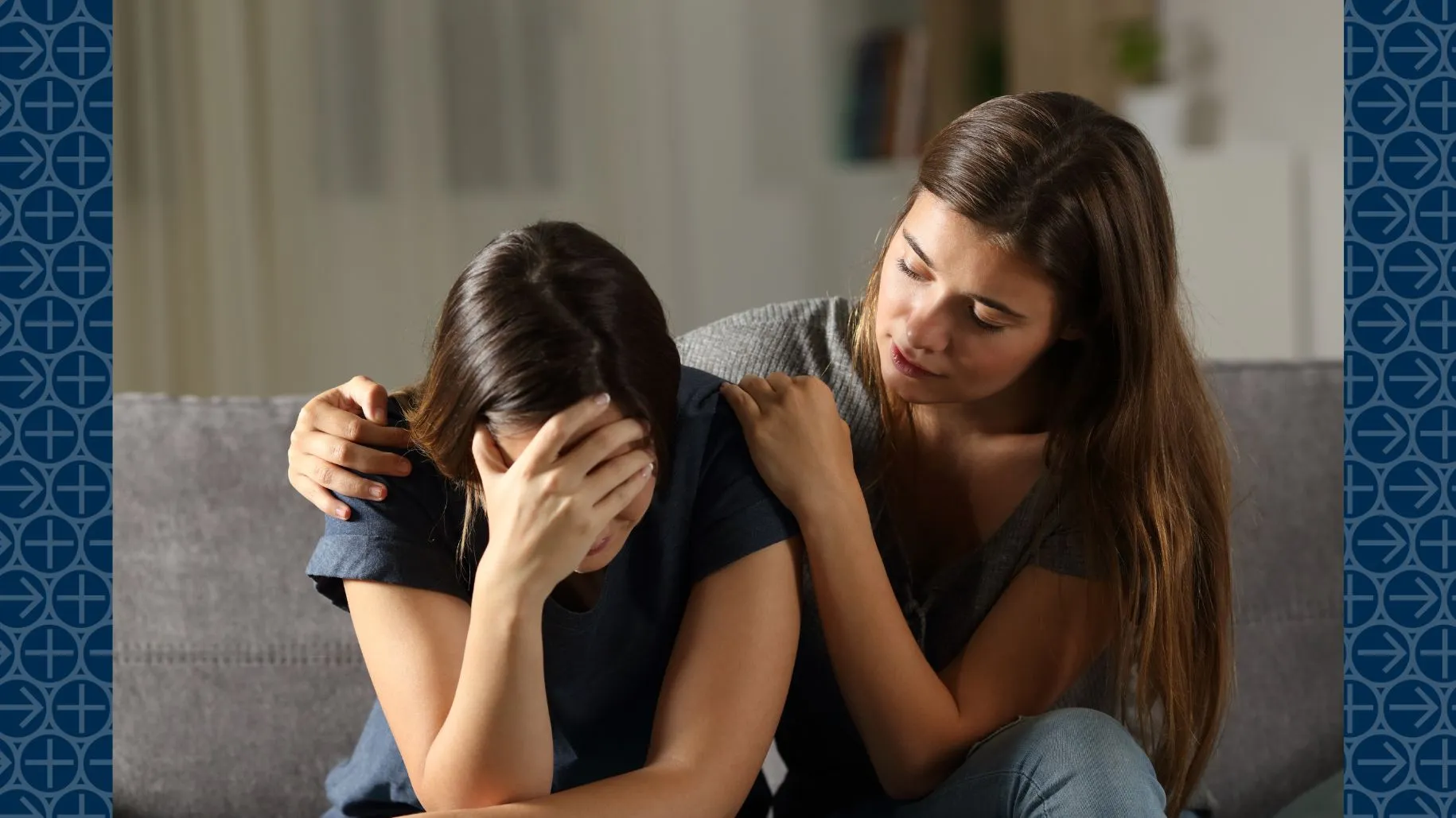 Young woman comforts sad friend
